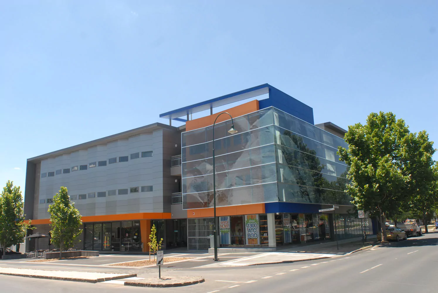 The façade of the ATC Bendigo with its external suspended feature glazed panel with a image digitally laminated into the glass.