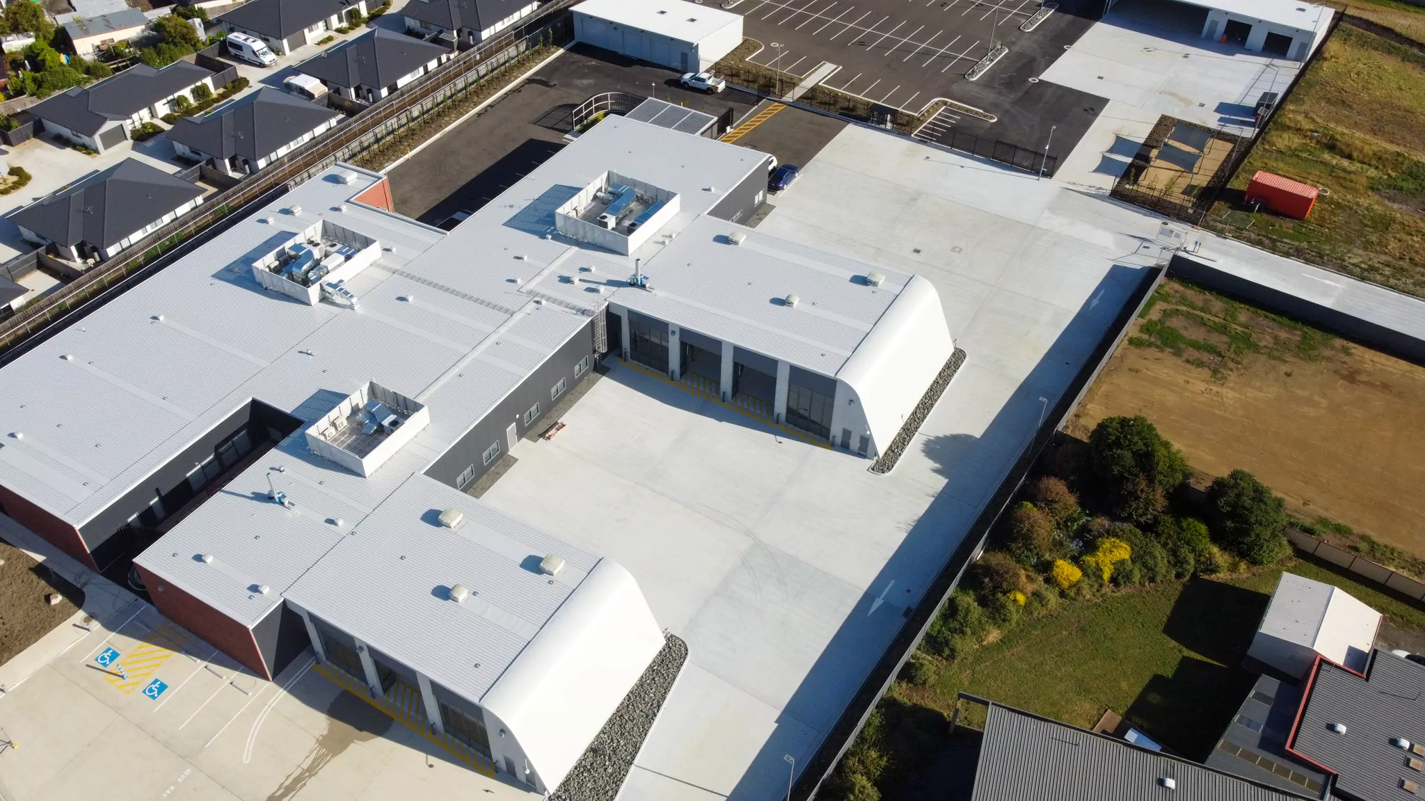 An overhead, drone photo of the Sorell Emergency Services Hub. From above, the large turning spaces and parking bay doors can be seen